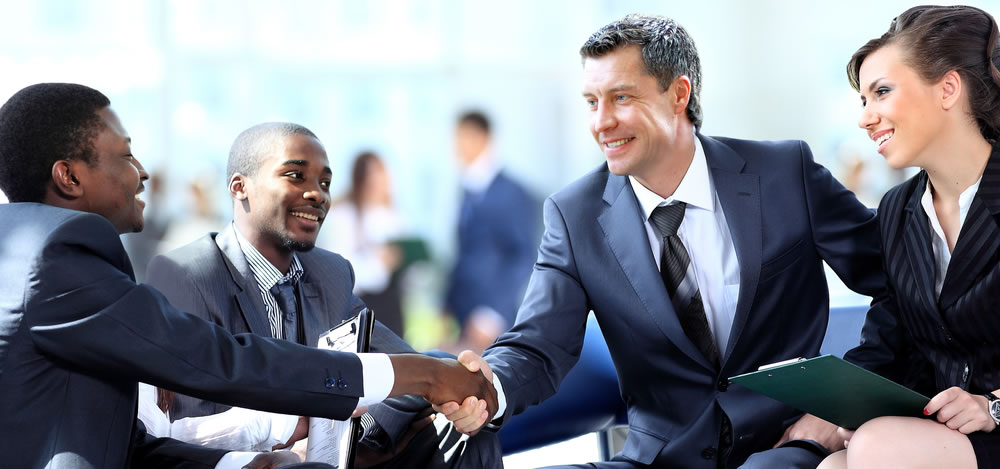 Shaking hands in a business environment